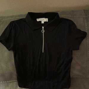 Black shirt with silver zip. Excellent condition. Size Medium. By Hippy Rose.